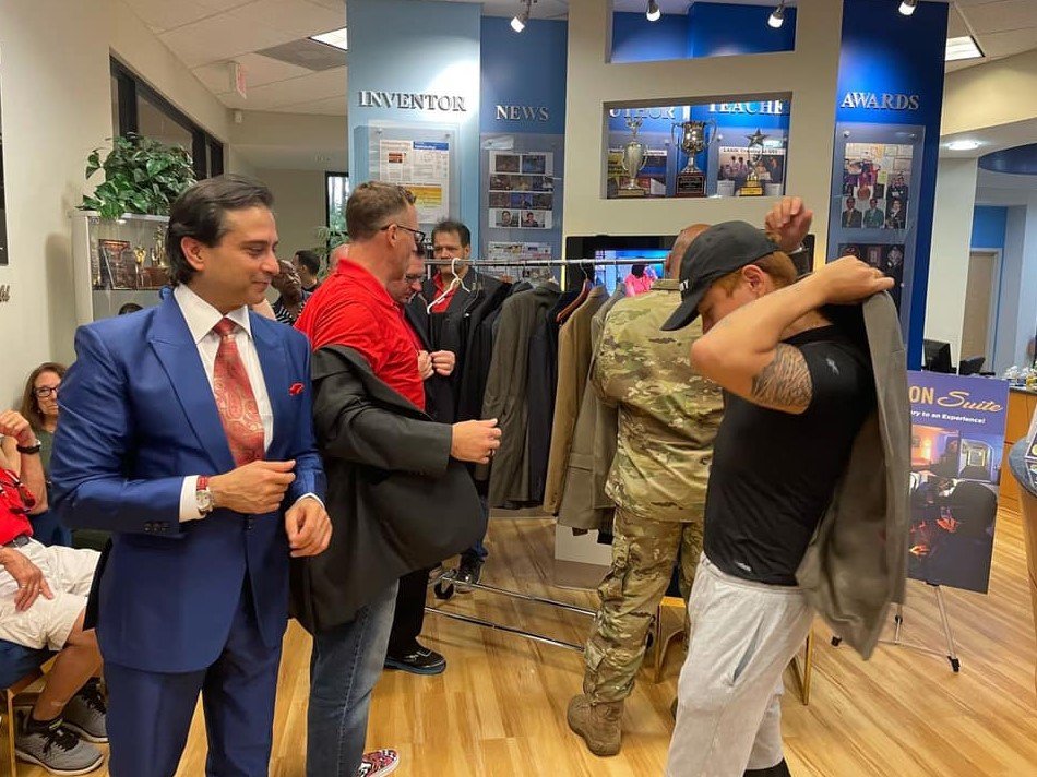 ‘Bespoke on the Boulevard’ was an opportunity to help artists and veterans who have lost their jobs due to the pandemic. Here, one of the recipients tries on a new jacket.